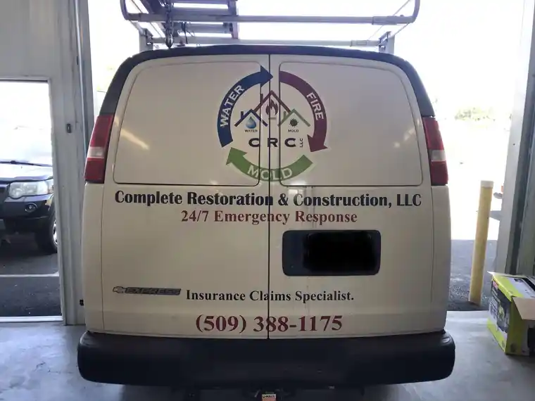 Rear doors of the CRC van: Complete Restoration & Construction, 24/7 Emergency Response, Insurance Claims Specialist, (509) 388-1175