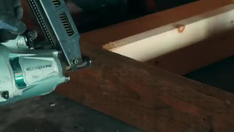A framing nailer working on a timber, from our site video.